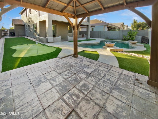 view of patio featuring a fenced in pool