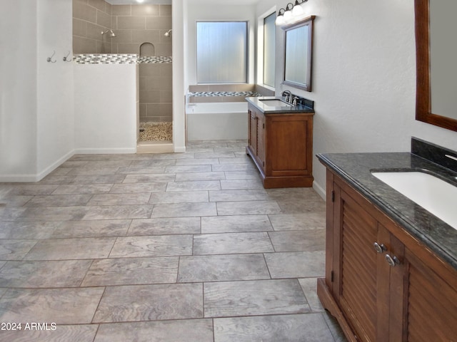 bathroom with separate shower and tub and vanity