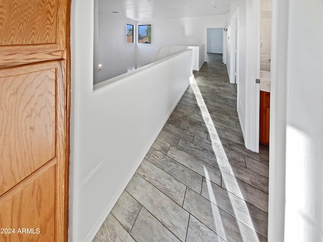 hallway featuring hardwood / wood-style flooring