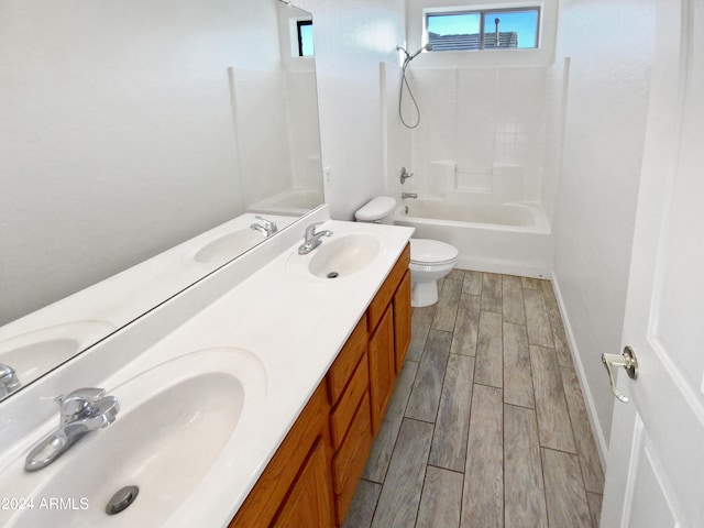 full bathroom with hardwood / wood-style flooring, vanity, toilet, and  shower combination