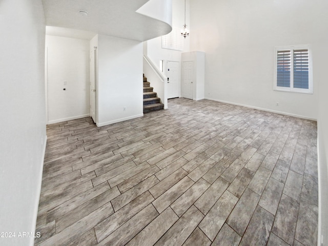 interior space featuring a notable chandelier and light hardwood / wood-style flooring