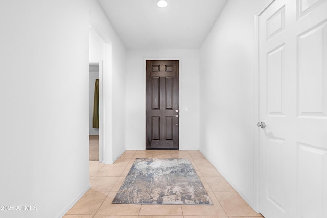 hallway featuring light tile patterned floors