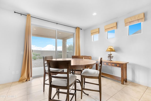 dining space with light tile patterned floors