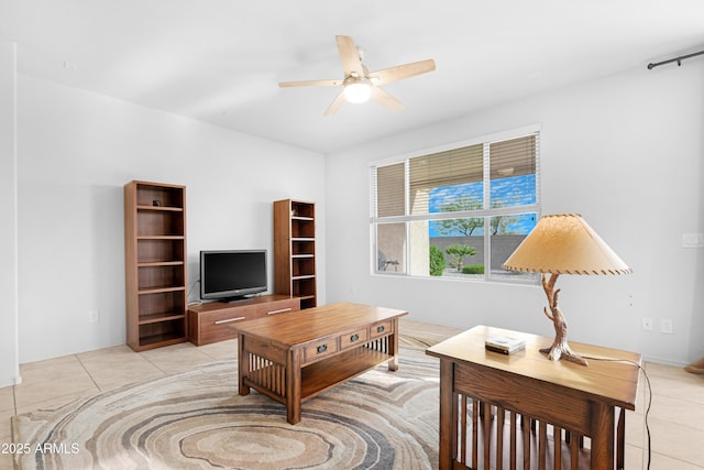 living room featuring light tile patterned floors and ceiling fan