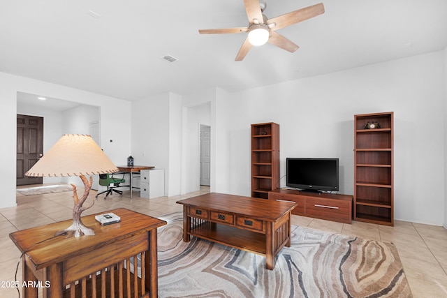 living room featuring ceiling fan and light tile patterned flooring