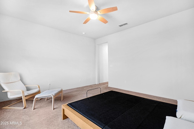 unfurnished bedroom with ceiling fan and light carpet