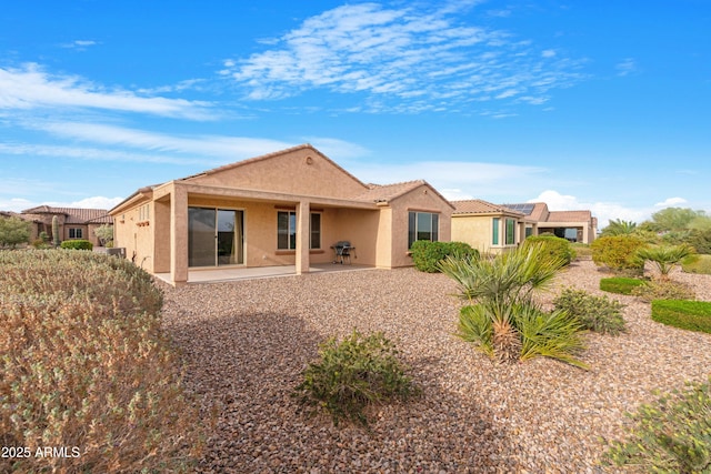 rear view of house featuring a patio area