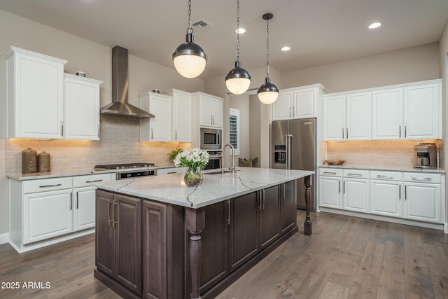26673 W Ponderosa Ln, Buckeye, AZ 85396 - kitchen featuring wall chimney range hood, white cabinetry, dark wood-type flooring, and stainless steel appliances