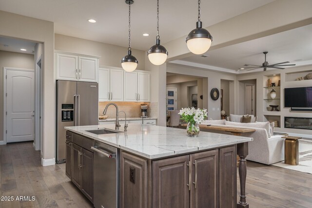 26673 W Ponderosa Ln, Buckeye, AZ 85396 - kitchen featuring white cabinetry, high end fridge, a sink, and wood finished floors
