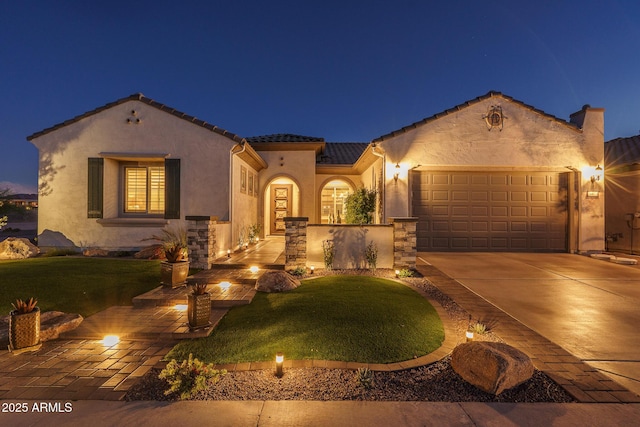 26673 W Ponderosa Ln, Buckeye, AZ 85396 - mediterranean / spanish-style house featuring a tile roof, concrete driveway, stucco siding, an attached garage, and a lawn