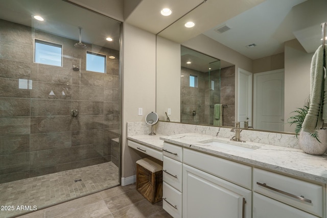26673 W Ponderosa Ln, Buckeye, AZ 85396 - bathroom featuring vanity, tiled shower, visible vents, and recessed lighting