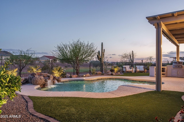 26673 W Ponderosa Ln, Buckeye, AZ 85396 - view of pool with a fenced in pool, fence, and a lawn