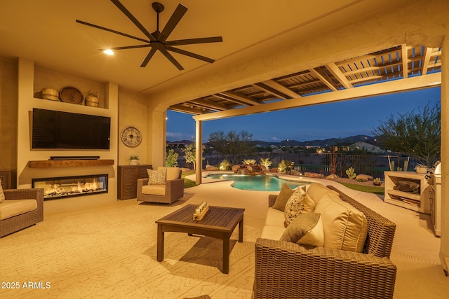26673 W Ponderosa Ln, Buckeye, AZ 85396 - view of patio with a fenced backyard, an outdoor living space with a fireplace, ceiling fan, and a fenced in pool