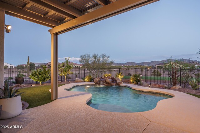 26673 W Ponderosa Ln, Buckeye, AZ 85396 - view of pool with a fenced backyard, a fenced in pool, a mountain view, and a patio