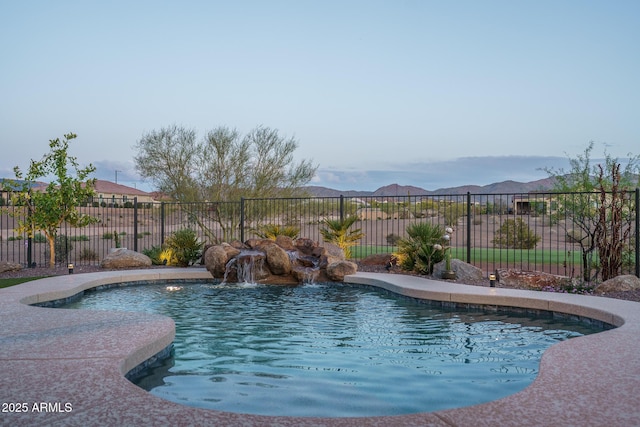 26673 W Ponderosa Ln, Buckeye, AZ 85396 - view of swimming pool with fence, a mountain view, and a fenced in pool