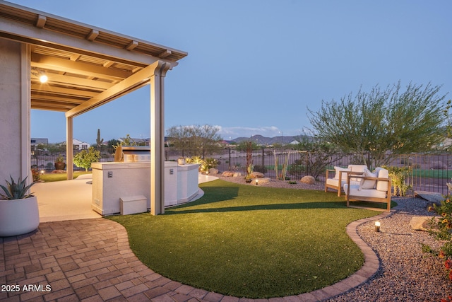 26673 W Ponderosa Ln, Buckeye, AZ 85396 - view of yard with a mountain view, a fenced backyard, and a patio area
