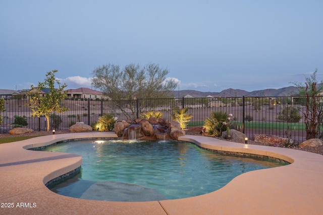 26673 W Ponderosa Ln, Buckeye, AZ 85396 - view of pool featuring a mountain view, fence, and a fenced in pool