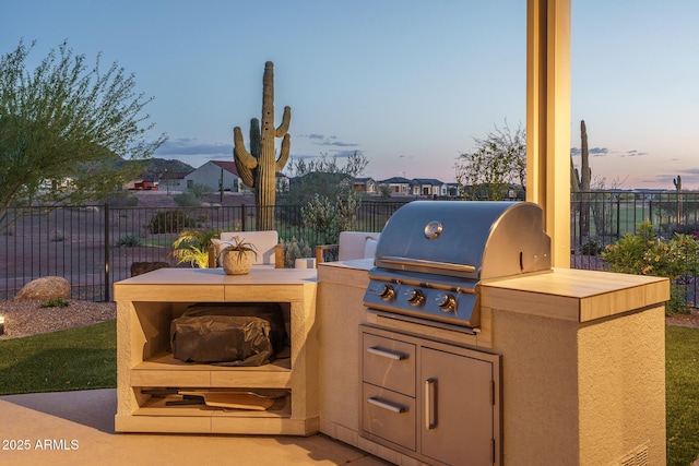 26673 W Ponderosa Ln, Buckeye, AZ 85396 - view of patio / terrace with an outdoor kitchen, area for grilling, and fence