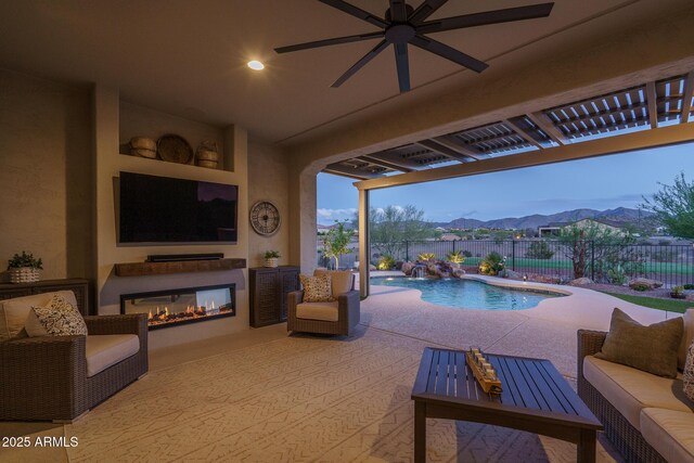 26673 W Ponderosa Ln, Buckeye, AZ 85396 - view of pool featuring a fenced backyard, ceiling fan, an outdoor living space with a fireplace, and a patio area