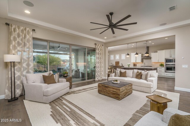 26673 W Ponderosa Ln, Buckeye, AZ 85396 - living area featuring recessed lighting, dark wood-style flooring, baseboards, visible vents, and a ceiling fan