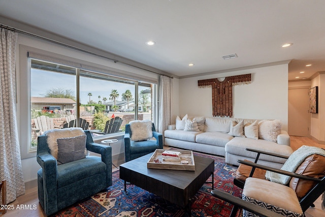 living room featuring visible vents, wood finished floors, and recessed lighting