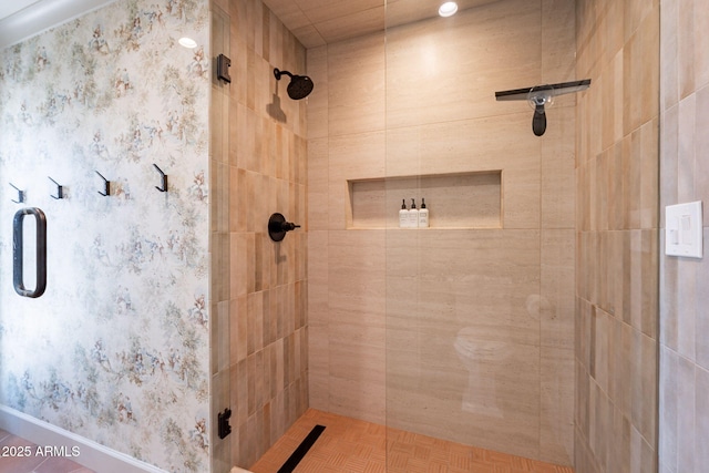 full bathroom with baseboards and a stall shower