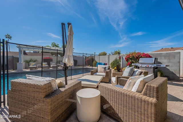 view of patio / terrace with an outdoor hangout area, a fenced in pool, a fenced backyard, and area for grilling
