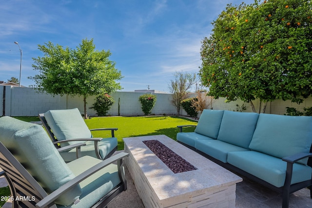 view of patio featuring an outdoor living space with a fire pit and a fenced backyard