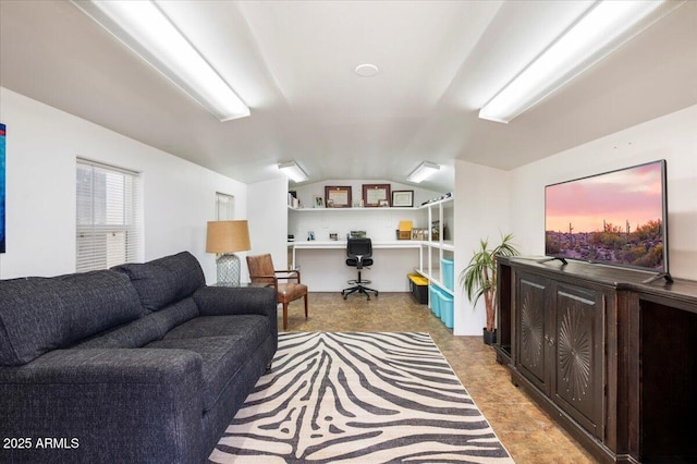 living room featuring vaulted ceiling