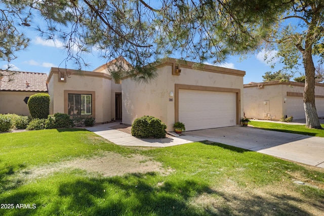 view of front of home with driveway, a front lawn, an attached garage, and stucco siding