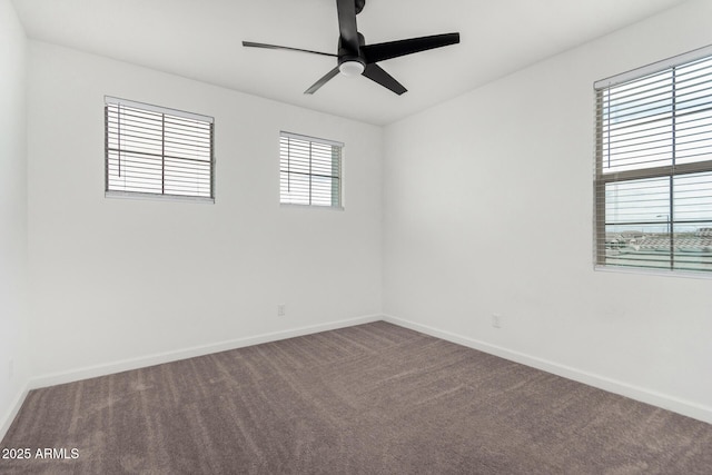 carpeted spare room with ceiling fan