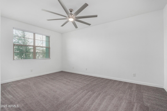 unfurnished room featuring ceiling fan and carpet flooring