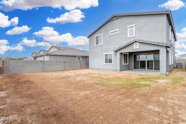 rear view of property with a patio area