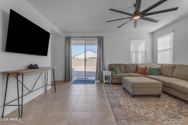 living room featuring ceiling fan, plenty of natural light, and light tile patterned flooring