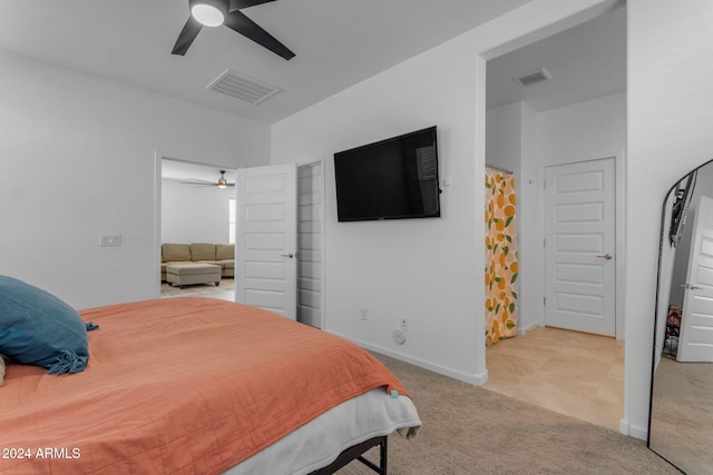 carpeted bedroom featuring ceiling fan