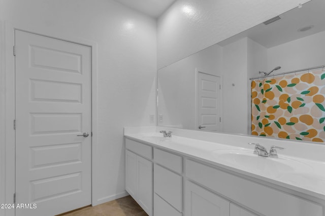 bathroom with a shower with curtain, tile patterned flooring, and vanity