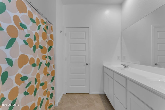 bathroom with tile patterned floors and vanity