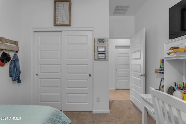 carpeted bedroom with a closet