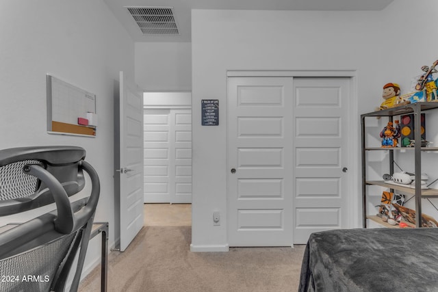 carpeted bedroom featuring a closet