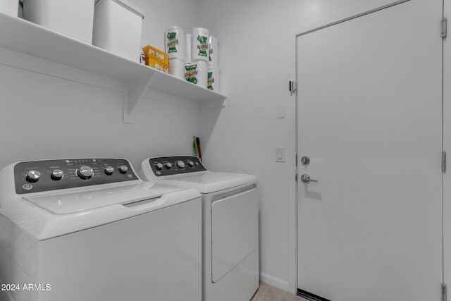 laundry area with independent washer and dryer