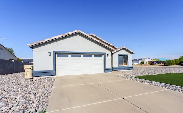 ranch-style home featuring a garage