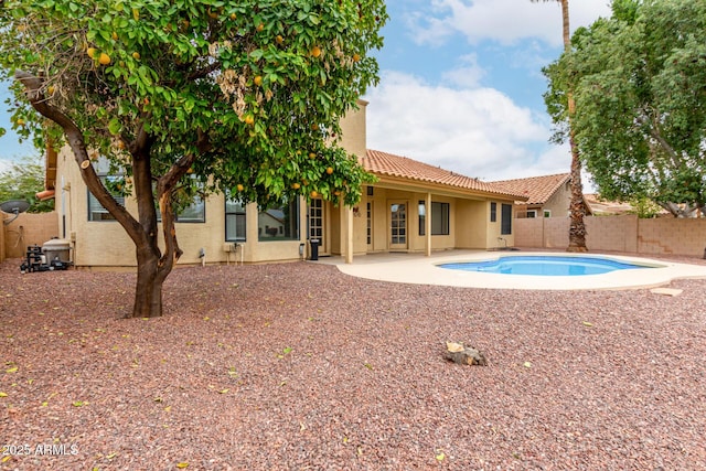 view of swimming pool featuring a patio area, a fenced in pool, and a fenced backyard