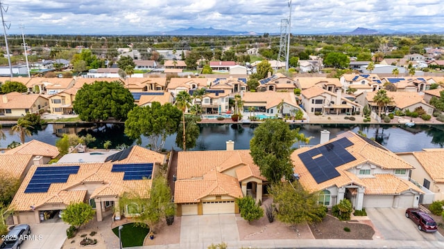 bird's eye view with a residential view and a water view