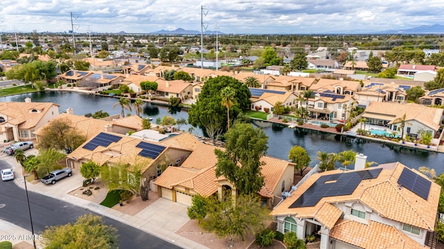 birds eye view of property featuring a residential view and a water view