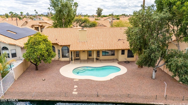 view of swimming pool featuring a fenced in pool, a fenced backyard, and a patio area