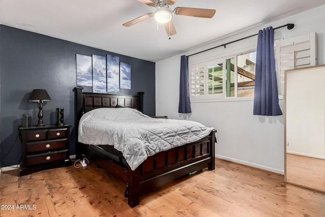 bedroom featuring ceiling fan and light hardwood / wood-style flooring