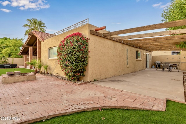 view of side of home with a pergola and a patio area