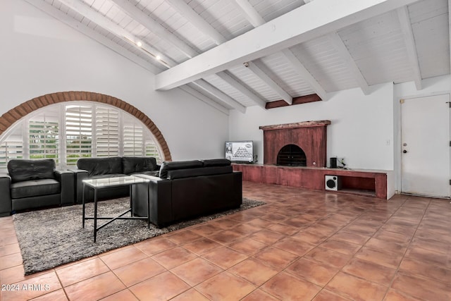 living room featuring tile patterned flooring, lofted ceiling with beams, and wood ceiling