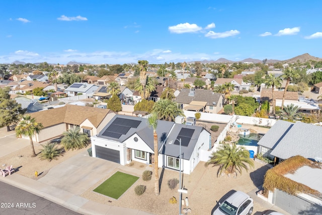 birds eye view of property featuring a mountain view