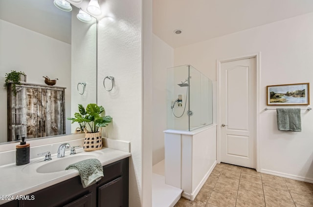 bathroom with vanity, tile patterned floors, and walk in shower